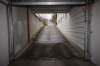 DIETZ: Unterer Tiefgaragenstellplatz eines Doppelparkers - Einfahrt mit Rolltor