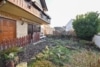 DIETZ: Provisionsfreie Erdgeschosswohnung mit eigenem Garten, großer Garage und Kellerraum in Harpertshausen! - Eigener Garten