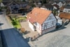 DIETZ: Modernisiertes, gepflegtes Fachwerkhaus mit großem Garten, Garage und Carport in Hasselroth! - Luftbild