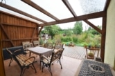DIETZ: Einfamilienhaus mit toller Architektur - große überdachte Terrasse - KACHELOFEN! - Überdachte Terrasse