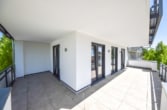 Terrasse 1 - Neuwertige 3 Zi-Wohnung im 1. OG mit Personenaufzug, Kellerraum und 2 PKW – Stellplätzen in Messel!