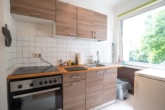 Küche - Vermietete 3-Zimmer-Eigentumswohnung im 1. Obergeschoss mit überdachtem Balkon!