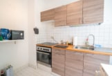 Küche - Vermietete 3-Zimmer-Eigentumswohnung im 1. Obergeschoss mit überdachtem Balkon!