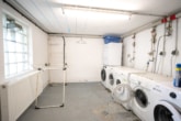 Waschküche - Vermietete 3-Zimmer-Eigentumswohnung im 1. Obergeschoss mit überdachtem Balkon!