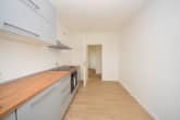 6498-lang13#Neue Einbauküche Inklusive - DIETZ: Modernisierte 2-Zimmer-Wohnung im 7. Obergeschoss mit Balkon in Bad-König! Neue Einbauküche, Kellerraum, Balkon