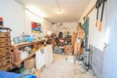 DIETZ: Tolles Einfamilienhaus mit Garten, 2 Terrassen, Doppelgarage und Keller in Großostheim! - Werkstatt unter der Garage