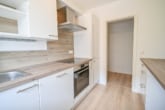 Küche - DIETZ: TIP-TOP 3-Zimmer-Eigentumswohnung mit Einbauküche, Stellplatz, TGL-Bad direkt in Ringheim!