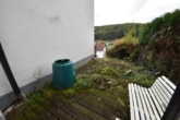 UG Schlafzimmer 2 mit Terrasse - DIETZ: 2 bis 3 Familienhaus mit schönem Blick, Doppelgarage in Waldrandlage! 1 Wohneinheit frei!