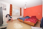 Schlafzimmer 1 von 4 - DIETZ: Bungalowimmobilie mit viel Wiesenfläche in einer herrlichen Feldrandlage von Otzberg!