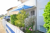 überdachte Terrasse - DIETZ: Frei werdende 4-5-Zimmer Maisonettewohnung mit Terrasse, Garage und Grünfläche in Niedernberg